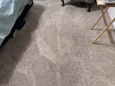 After stretching showing a smoother carpet surface
