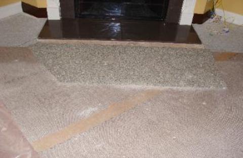 Carpet Repair New Fireplace Install Before - YesSir Services carpet project in Metro Atlanta